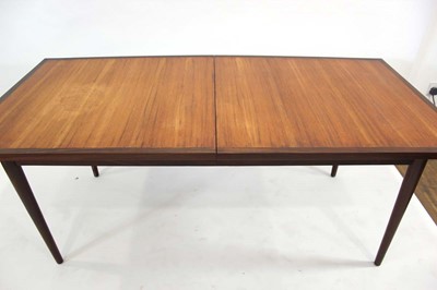 Lot 20 - A 1970's teak and crossbanded extending dining...