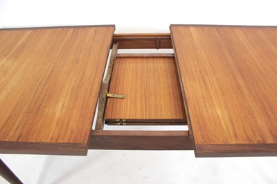 Lot 20 - A 1970's teak and crossbanded extending dining...