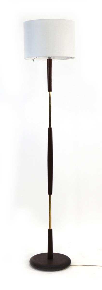 Lot 68 - A 1970's teak and brass undulating floor lamp...