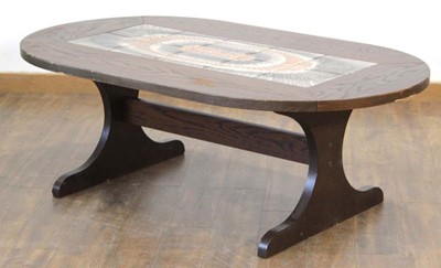 Lot 177 - A 1970/80's Danish stained oval coffee table...