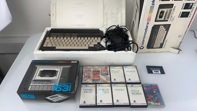 Lot 1124 - Commodore plus/4 in box with qty of games