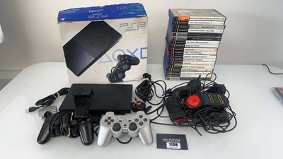 Lot 1138 - Sony PlayStation 2 Slimline with accessories...