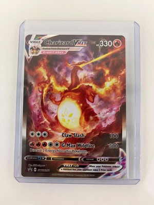 Lot 1264 - (3) Top Loaded Pokémon TCG Charizard Cards:...
