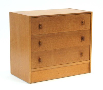 Lot 45 - A 1960's oak chest of four drawers on a plinth...