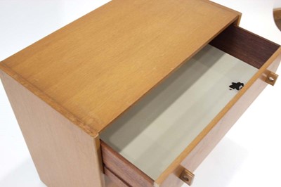 Lot 45 - A 1960's oak chest of four drawers on a plinth...