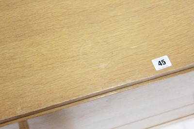 Lot 45 - A 1960's oak chest of four drawers on a plinth...