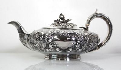 Lot 200 - A Regency silver teapot of squat form with...