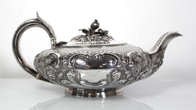 Lot 200 - A Regency silver teapot of squat form with...