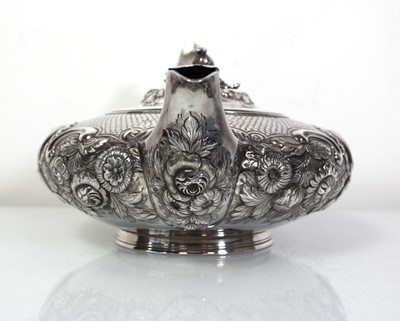 Lot 200 - A Regency silver teapot of squat form with...