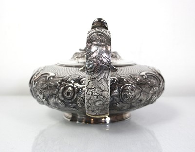 Lot 200 - A Regency silver teapot of squat form with...