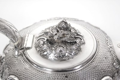 Lot 200 - A Regency silver teapot of squat form with...