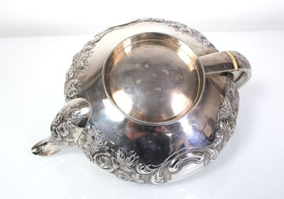 Lot 200 - A Regency silver teapot of squat form with...