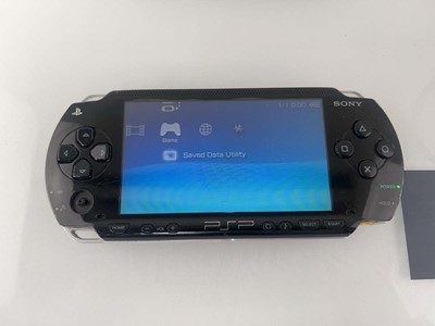Lot 1142 - 3x Sony PSP handheld consoles with 6x games