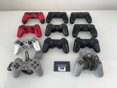 Lot 1144 - Qty of PlayStation controllers