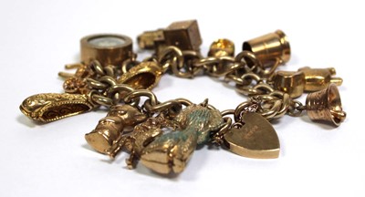 Lot 621 - A 9ct yellow gold curblink bracelet with heart...
