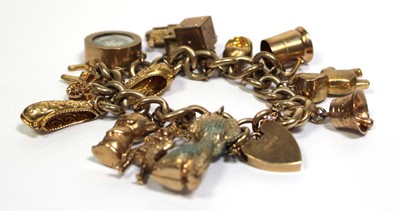 Lot 621 - A 9ct yellow gold curblink bracelet with heart...