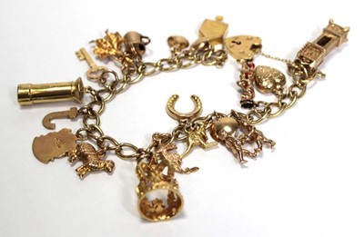 Lot 628 - A 9ct yellow gold curblink bracelet with heart...