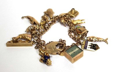 Lot 629 - A 9ct yellow gold curblink bracelet with heart...