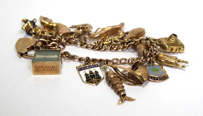 Lot 629 - A 9ct yellow gold curblink bracelet with heart...