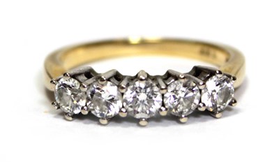 Lot 630 - An 18ct yellow gold ring set five brilliant...