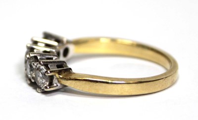 Lot 630 - An 18ct yellow gold ring set five brilliant...