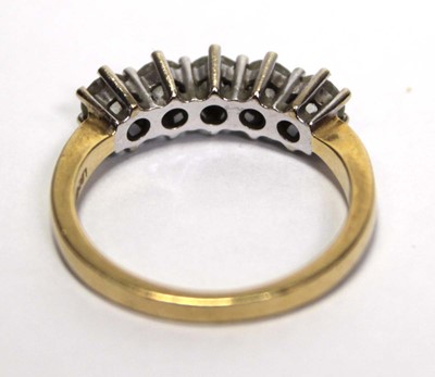 Lot 630 - An 18ct yellow gold ring set five brilliant...