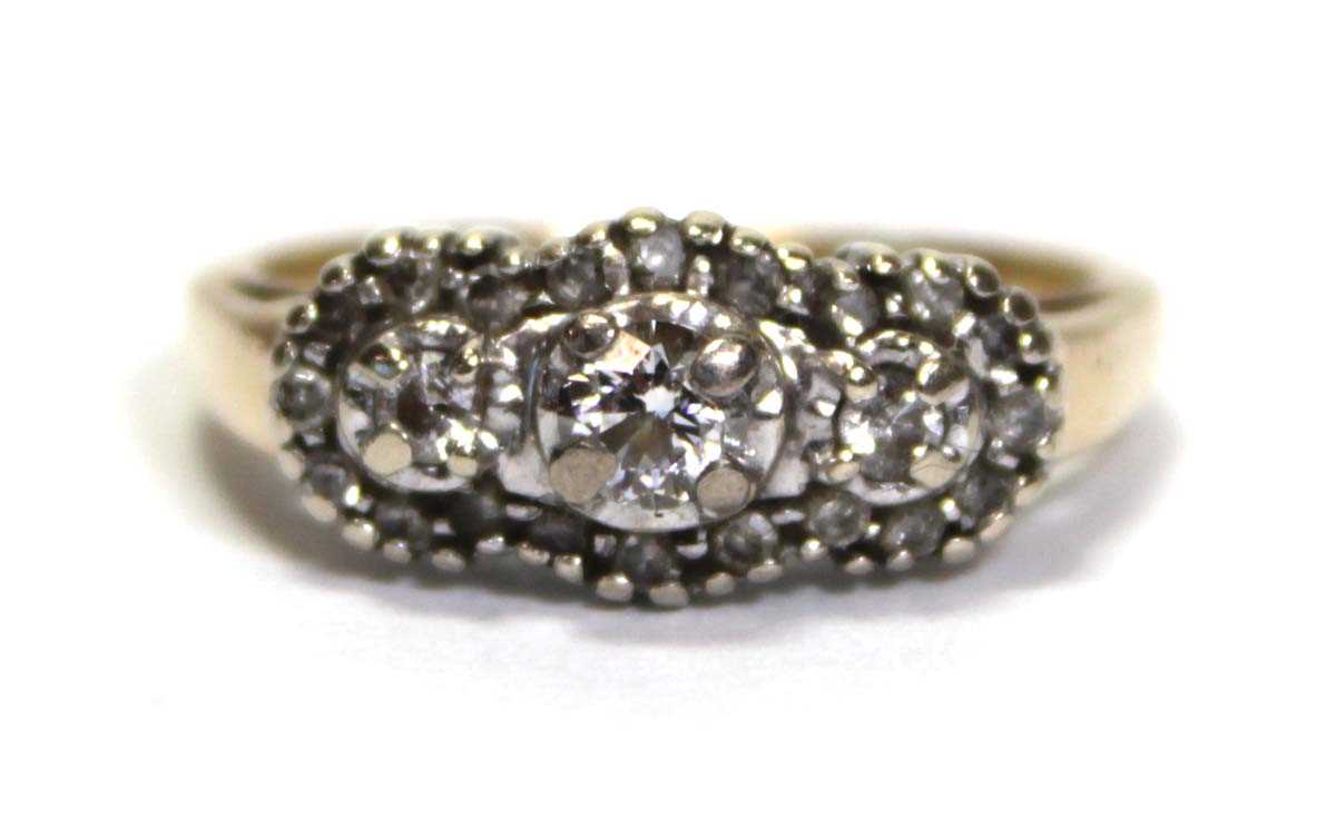 Lot 631 - A 14ct yellow gold ring set small diamonds in...