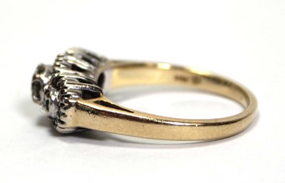 Lot 631 - A 14ct yellow gold ring set small diamonds in...