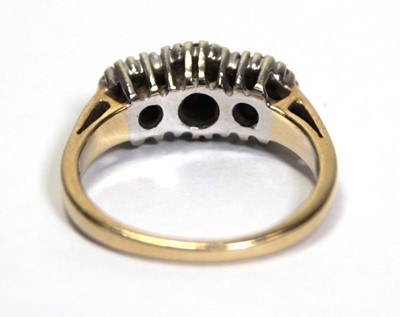 Lot 631 - A 14ct yellow gold ring set small diamonds in...