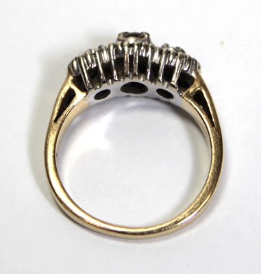 Lot 631 - A 14ct yellow gold ring set small diamonds in...