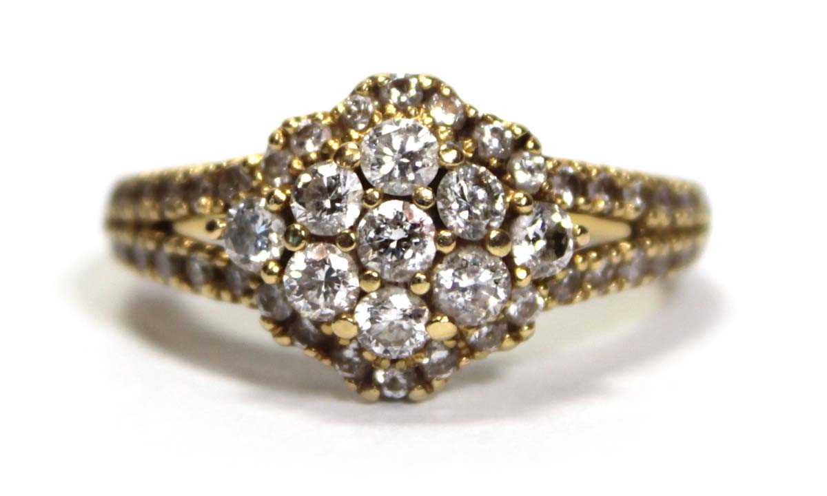 Lot 632 - An 18ct yellow gold cluster ring set small...