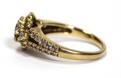Lot 632 - An 18ct yellow gold cluster ring set small...