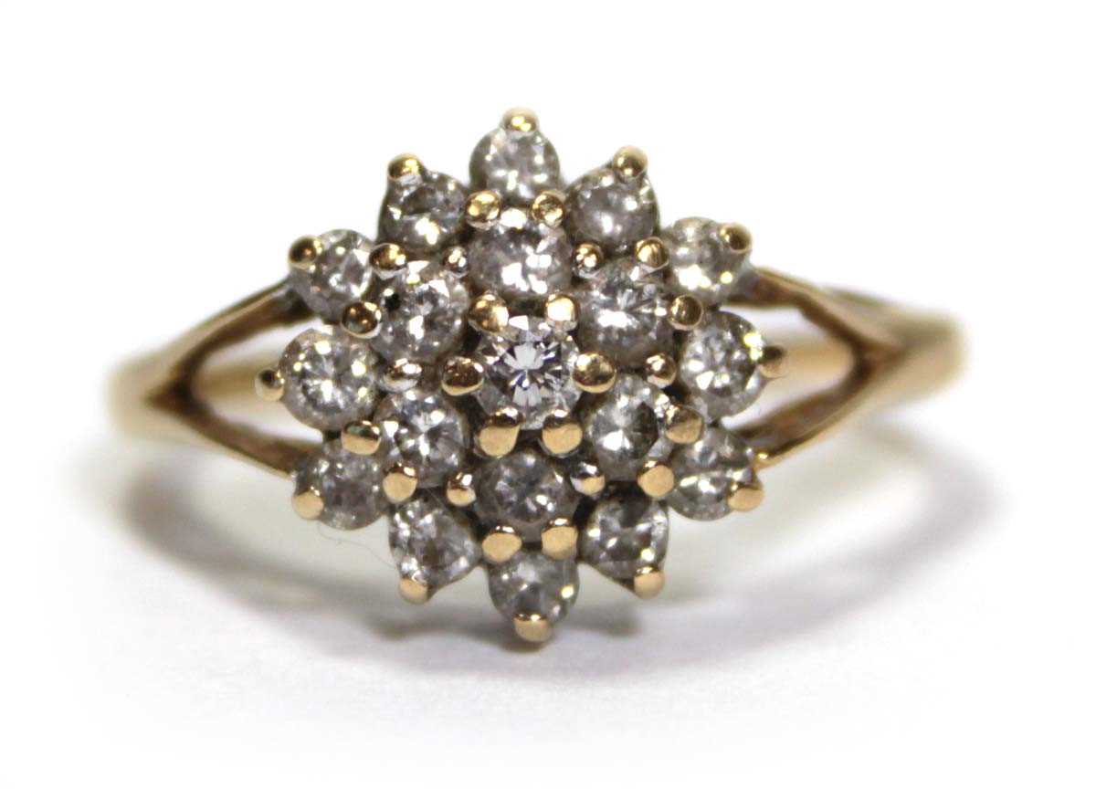 Lot 633 - An 18ct yellow gold cluster ring set small...