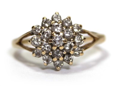 Lot 633 - An 18ct yellow gold cluster ring set small...