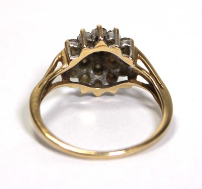 Lot 633 - An 18ct yellow gold cluster ring set small...