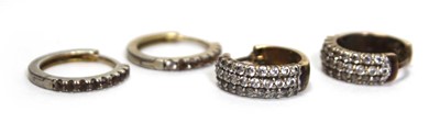 Lot 635 - A pair of 9ct yellow gold ear hoops set paste,...