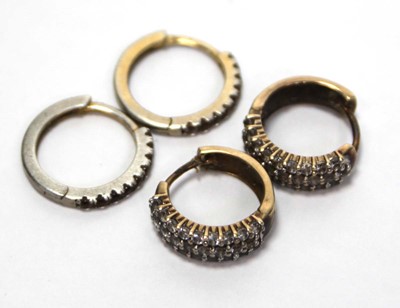 Lot 635 - A pair of 9ct yellow gold ear hoops set paste,...