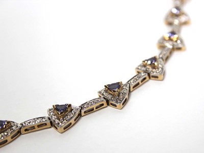 Lot 636 - A 14ct yellow gold bracelet set nine sections,...