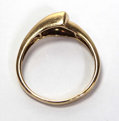 Lot 638 - A 14ct yellow gold ring set a trillion cut...