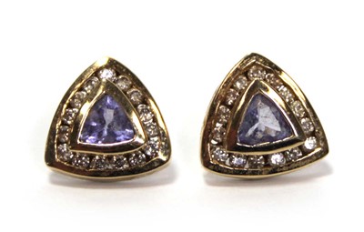 Lot 639 - A pair of 14ct yellow gold ear studs, each set...