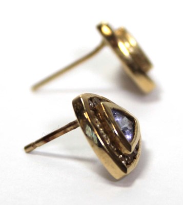 Lot 639 - A pair of 14ct yellow gold ear studs, each set...