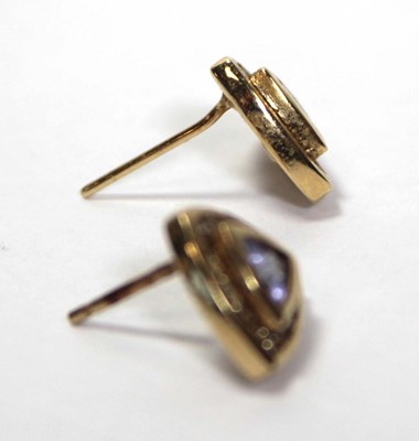 Lot 639 - A pair of 14ct yellow gold ear studs, each set...