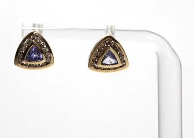 Lot 639 - A pair of 14ct yellow gold ear studs, each set...
