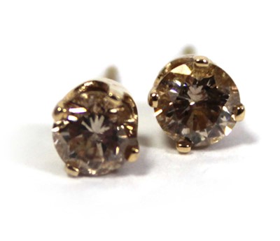 Lot 641 - A pair of 14ct yellow gold ear studs, each set...