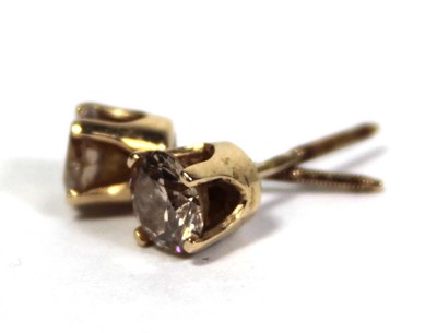 Lot 641 - A pair of 14ct yellow gold ear studs, each set...