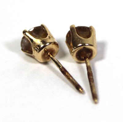 Lot 641 - A pair of 14ct yellow gold ear studs, each set...