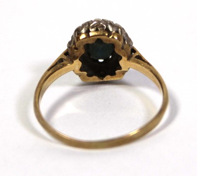 Lot 643 - An 18ct yellow gold cluster ring set oval...