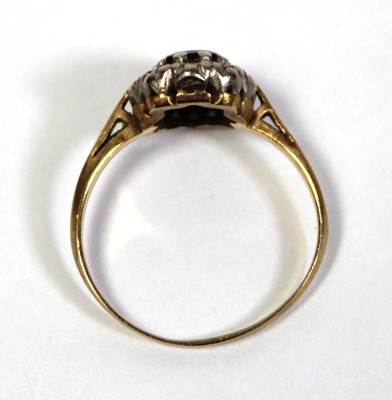Lot 643 - An 18ct yellow gold cluster ring set oval...