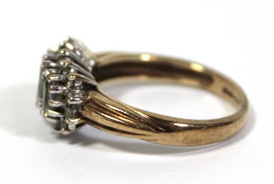 Lot 644 - A 9ct yellow gold ring set three graduated...