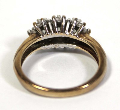 Lot 644 - A 9ct yellow gold ring set three graduated...